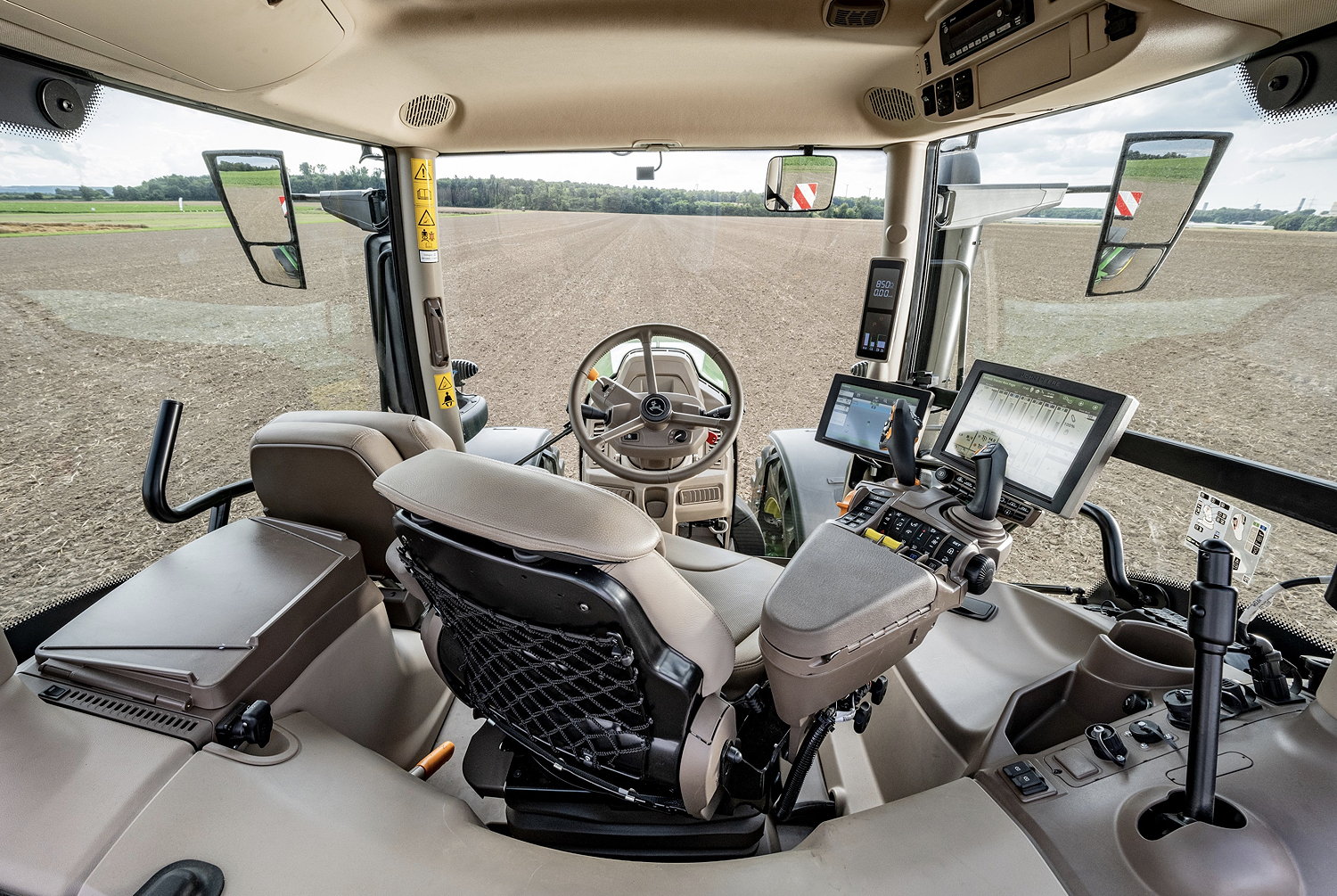 The dashboard behind the steering wheel has disappeared from the latest Deere 6R tractors