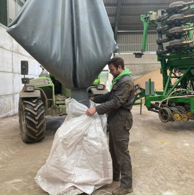 Olly Harrison demonstrates how the SeedSock’s discharge chute gives controlled transfer of seed back into a sack.