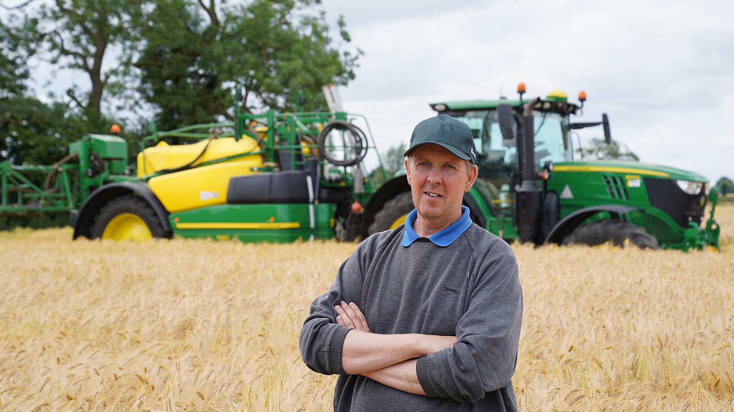 Steve May pulls his John Deere R962i sprayer with a 6215R AutoPowr.