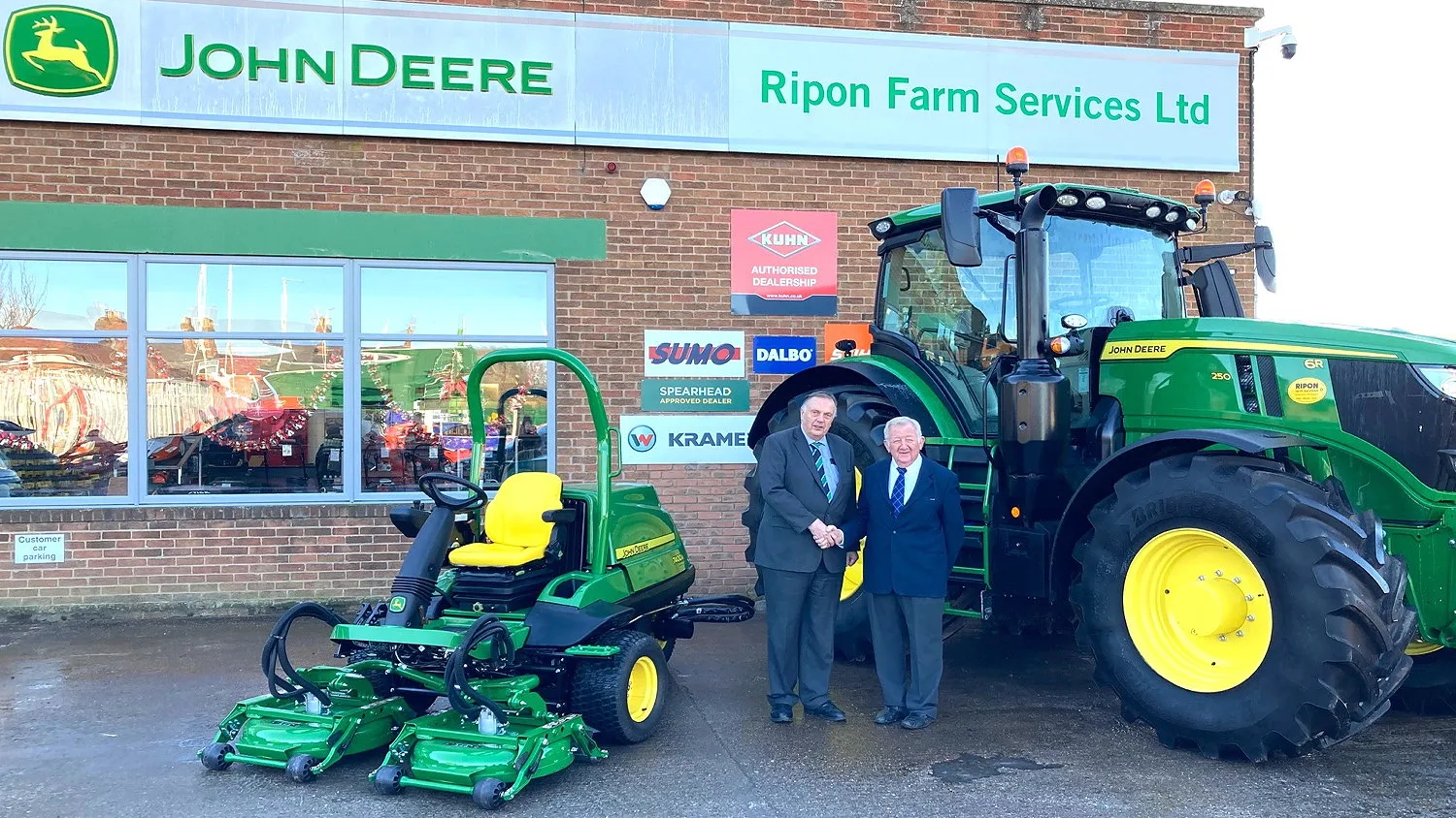 Ripon Farm Services has acquired John Deere groundscare dealership JG Adamson. RFS' Geoff Brown (left) is pictured with John Adamson.