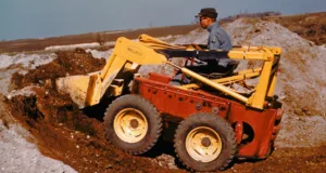 Louis Keller operating the Melroe M400 prototype that would become the first four-wheel skid-steer loader.