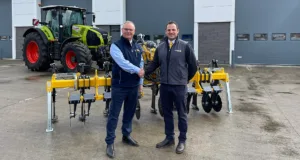 Manns' sales director Paul Moss (left) pictured with the managing director of Grange Machinery, Rhun Jones.