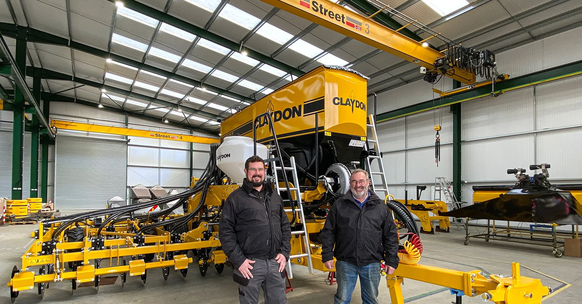 Jeff Claydon (right) and Oliver Claydon in the new Claydon Drill assembly building.